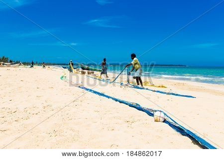 SRI LANKA - Mach 23: Local fishermen pull a fishing net from Indian Ocean on Mach 23, 2017 in Kosgoda, Sri Lanka. Fishing in Sri Lanka is the way they earn their living.