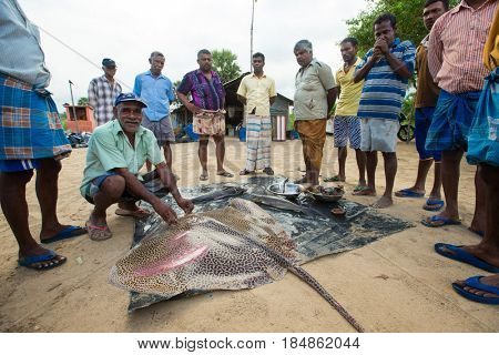 SRI LANKA - Mach 23: Local fishermen pull a fishing net from Indian Ocean on Mach 23, 2017 in Kosgoda, Sri Lanka. Fishing in Sri Lanka is the way they earn their living.