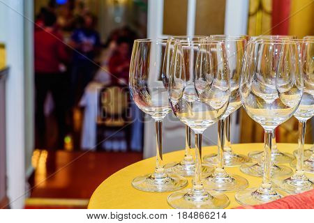 Closeup of emplty wineglasses standing at dinner party or rout