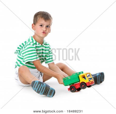 Boy Holding A Car