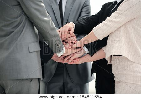 success concept collaboration: a friendly business team put thei