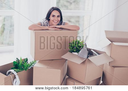 Close Up Portrait Of Nice Smiling Brunette Girl Which Put Her Hands And Head On The Box With Her Stu