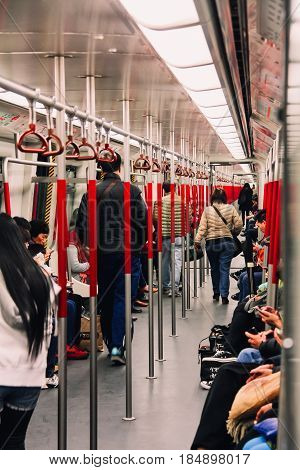 Hong Kong - December 29 2013: Passengers walking in Hong Kong MTR (Mass Transit Railway) Subway Train