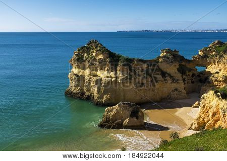 View of the scenic Praia dos Tres Irmaos in Alvor Algarve Portugal; Concept for travel in Portugal and explore Algarve