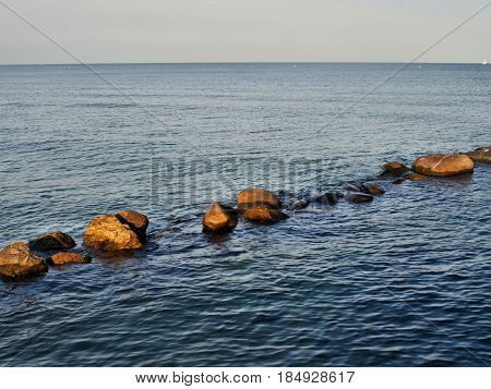 road from the rocks disappearing into the sea
