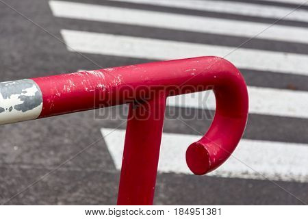 red railing against crosswalk