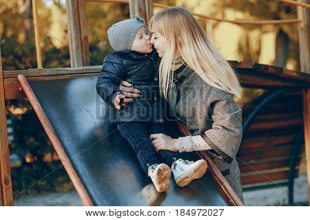 mother and little daughter in the autumn park