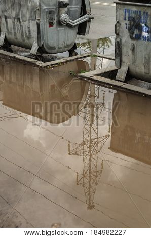 Reflection In Large Puddle On An Overcast Day