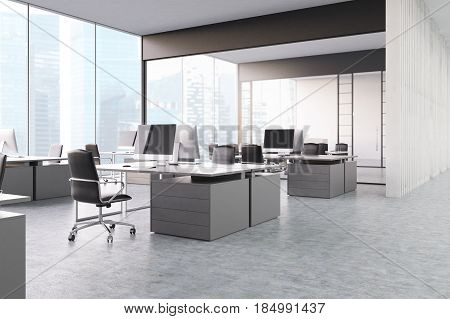 Gray open office with panoramic windows gray computer tables with desktops and black office chairs. 3d rendering.