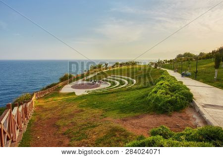 Beautiful Cityscape With Blue Sky And Sea. Sunny Day On The Sea Shore. Broadwalk In Antalya, Turkey.