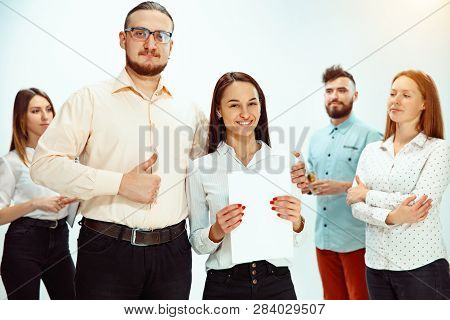 Boss Approving And Congratulating Young Successful Employee Of The Company For Her Successes And Goo