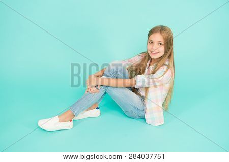 Kid Girl With Long Hair Relaxing. Just Relaxing Here. Feel Comfortable And Freely. Time To Relax. Fi