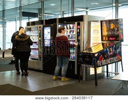 Basel, Switzerland - Nov 11, 2017: People Buying Food And Snacks From The Vending Machines In The Ba
