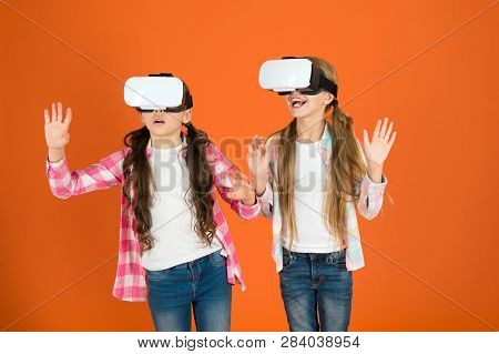 Kids Girls Play Virtual Reality Game. Friends Interact In Vr. Explore Alternative Reality. Future Is