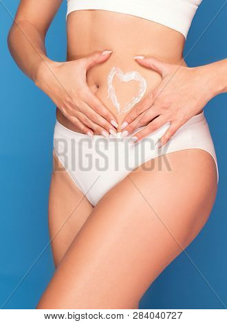 Caucasian Woman With Soft And Smooth Skin Posing In White Underwear. Cream On Her Body .healthy Life