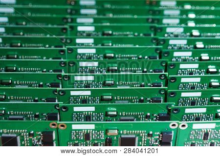 Microelectronics Industry And Manufacturing. Stack Of Produced  Printed Circuit Boards With Surface 