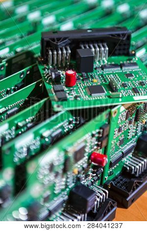 Microelectronics Industry And Manufacturing. Stack Of Produced  Printed Circuit Boards With Surface 