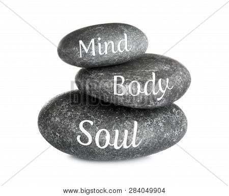 Stack Of Zen Stones With Words Mind, Body, Soul On White Background