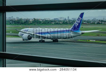 Passenger Airplane At Manila Airport, Philippines