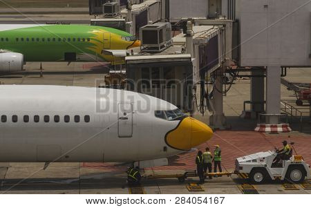 Airport With Airplanes Parking At Apron In Bankok Thailand.