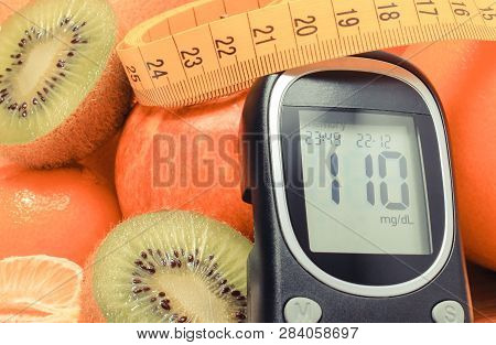 Glucose Meter, Fresh Ripe Natural Fruits With Tape Measure And Glass Of Juice On Cutting Board, Conc