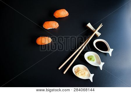 Close Up Top View Mix Sushi With Various Ingrediant As Salmon, Tuna, Avocado,sesame On Black Backgro