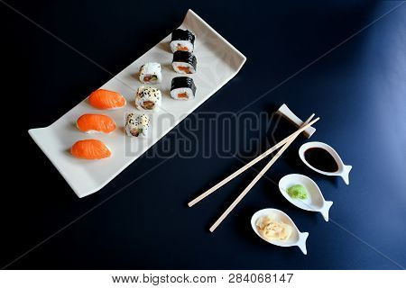 Close Up Top View Mix Sushi With Various Ingrediant As Salmon, Tuna, Avocado,sesame On Black Backgro