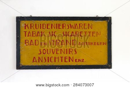 Sign Saying 'groceries, Tabaco, Cigarettes, Bath, Beach, Souvenirs And Postcards' In Dutch