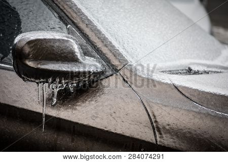 Close Up Shot Of A Frozen Car Mirror After Freezing Rain.