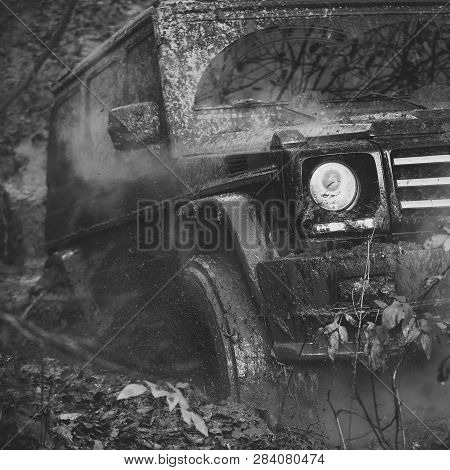 Suv Or Powerful Offroad Car Rides With Obstacles In Forest Area. Crossover Driving With Cloud Of Smo