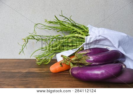 Zero Waste Use Less Plastic Concept / Fresh Vegetables Organic In Eco Cotton Fabric Bags On Wooden T