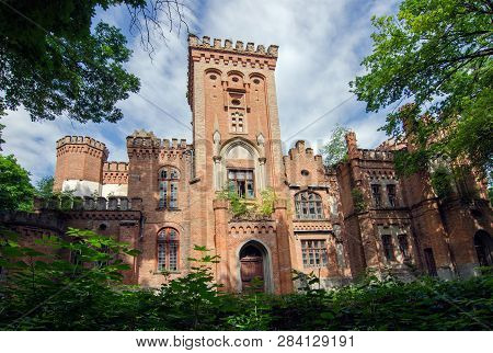 The Ancient Palace In The Gothic Style Against The Sky With Clouds In Manor  Dakhovsky, Leskovo, Che