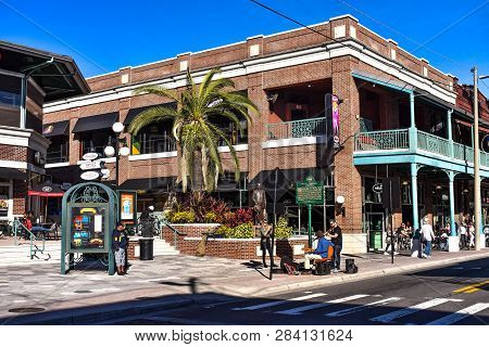 Ybor City Tampa Bay, Florida. January 19 , 2019  Woman Recording Image Of Guitarist And Violinist On