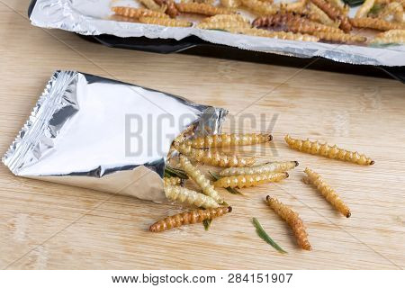 Bamboo Worm Insects For Eating As Food. Bamboo Caterpillar Deep-fried Or Baked Crispy Snack In A Foi