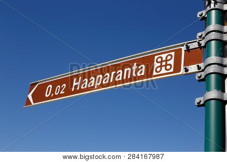 Signpost In Finland Written In Finnish With The Distance I Km To The Swedish Town Haparanda.