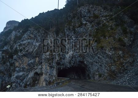 Road In A Tunnel Caught In The Rock Of A Gorge That Surrounds The Plandescun Reservoir A Rainy Day I
