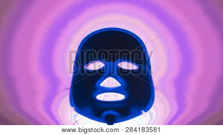 A Dark Blue Mask, Glowing On A Bright Pink And Purple Background