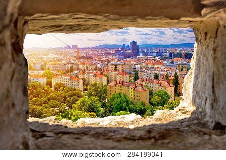 Vienna Cityscape And Sun Haze View Through Stone Window, Capital Of Austria