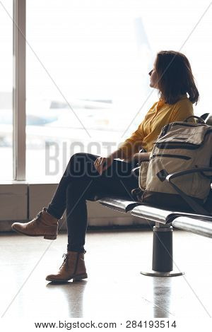 Girl With  Backpack Waiting For Departure