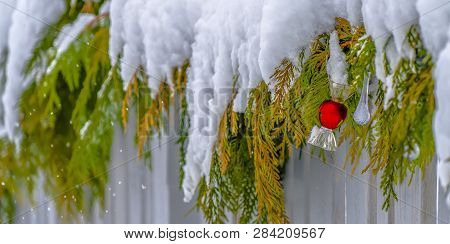 Fence Draped With Snowy Garland In Daybreak Utah