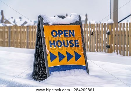 Open House Sign Against A Winter Landscape In Utah