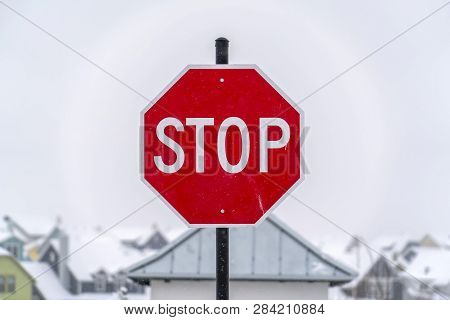 Stop Sign Against Homes And Sky In Daybreak Utah