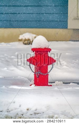 Vibrant Red Fire Hydrant Against Powdery Snow