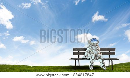 Rocketman on bench. Mixed media