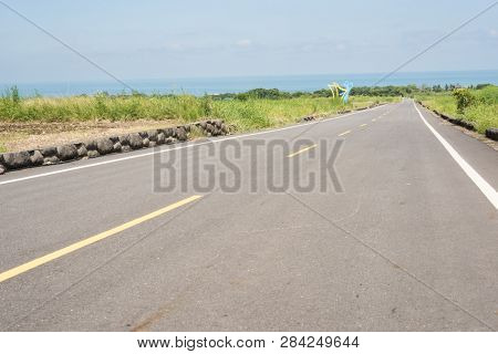 road at green paddy farm in the countryside