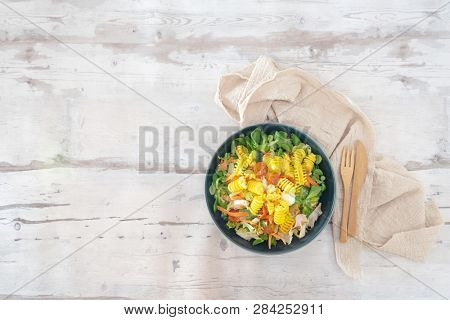 Salad made from radiatori cooked pasta, goat cheese and oil vinaigrette