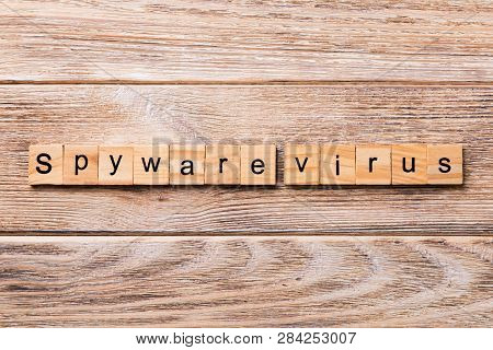 Spyware Virus Word Written On Wood Block. Spyware Virus Text On Wooden Table For Your Desing, Concep