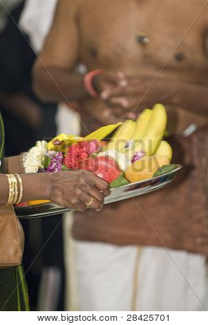 Hindu Devotee Carries Fruit Offerings On A Tray During The Chariot Festival At Richmond Hill Temple