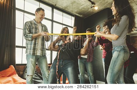 Friends Partying, Having Fun Playing Limbo Game