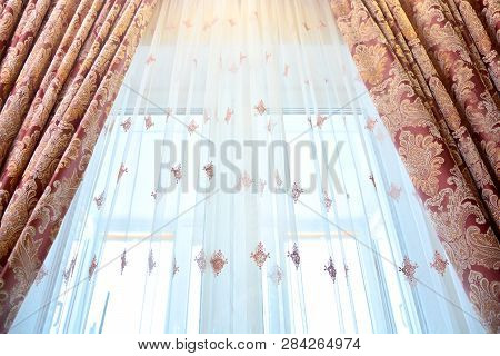 Window Curtains Background. Home Textile Decor. Close Up.